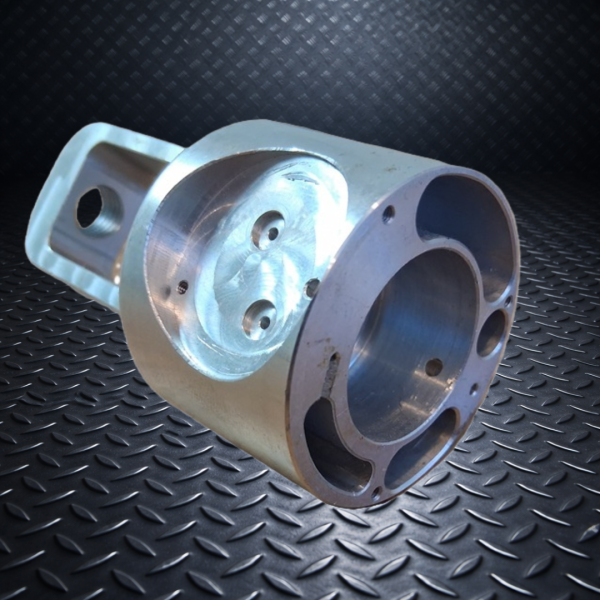 Precision CNC machined aluminum housing component with multi-axis milling and turning features.